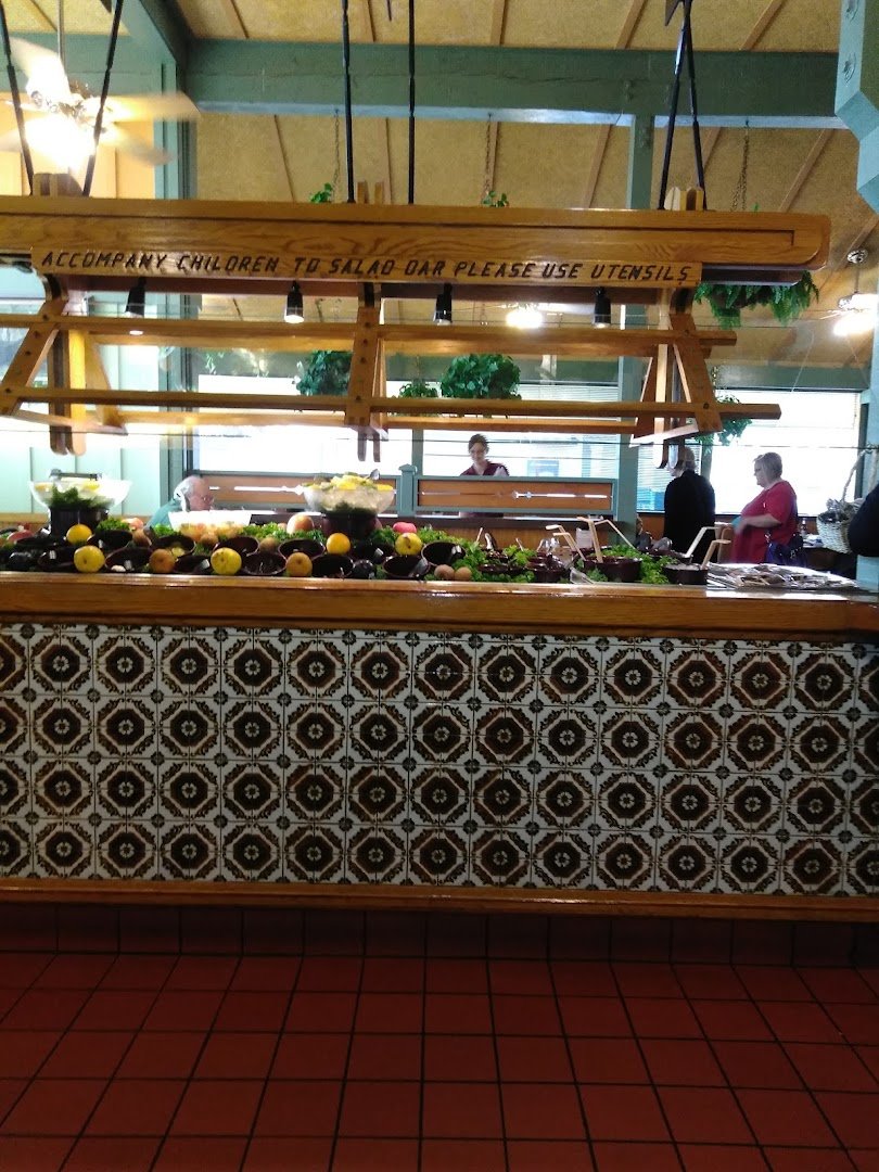 Breakfast plates on a simple restaurant table.