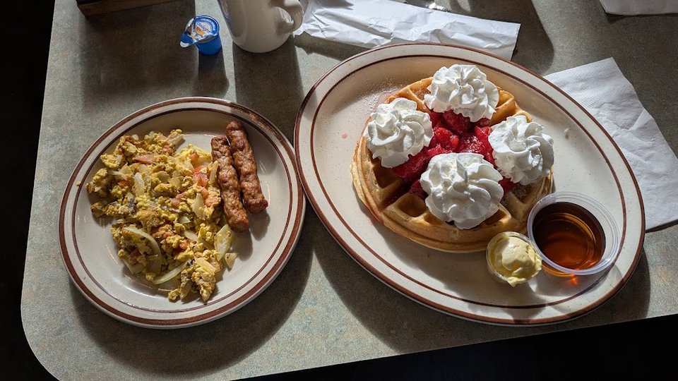 Menu page showing pancakes, waffles, and drinks.