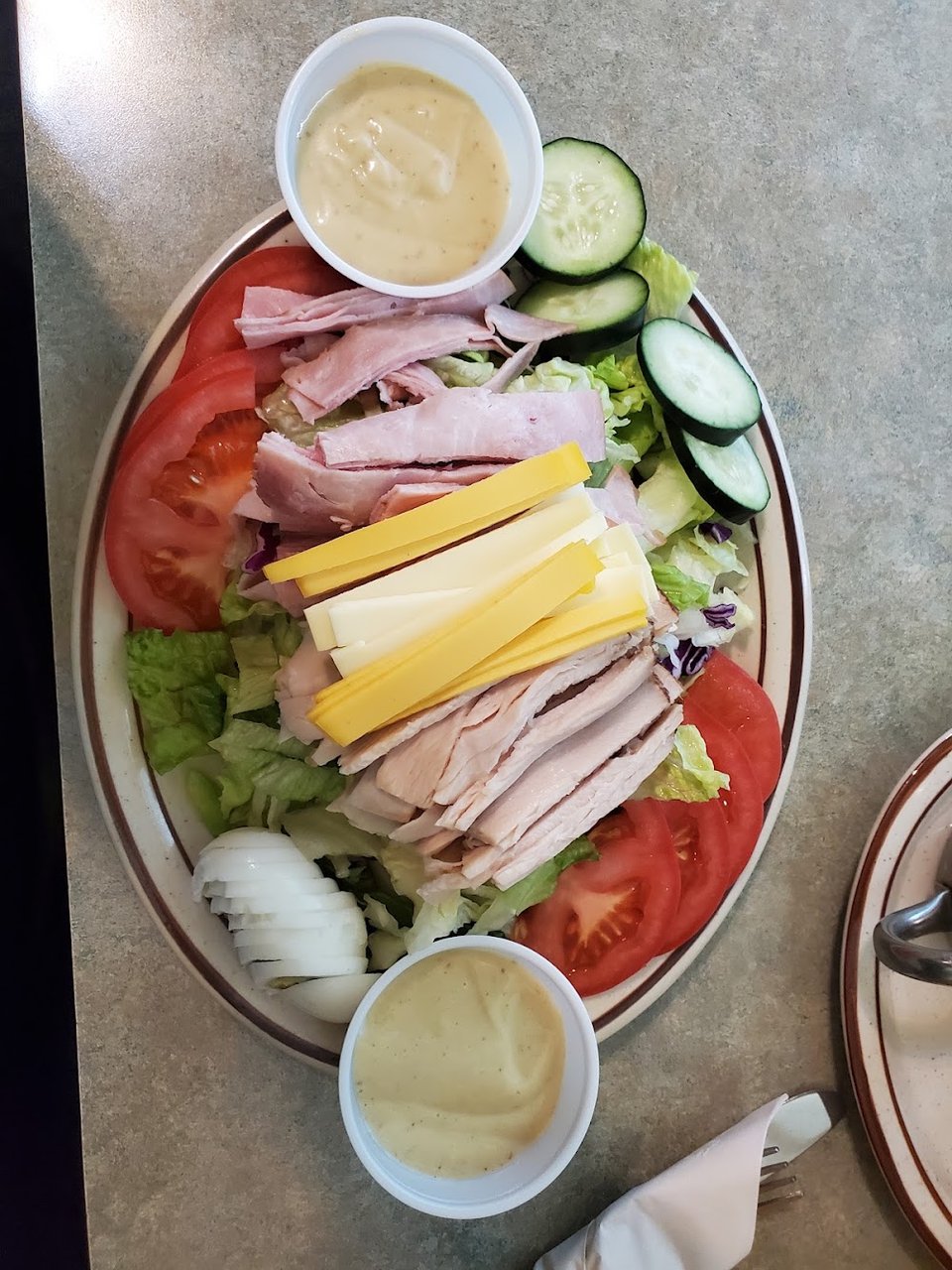 Printed menu with breakfast and lunch sections.